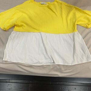 Zara’s yellow/white shirt   